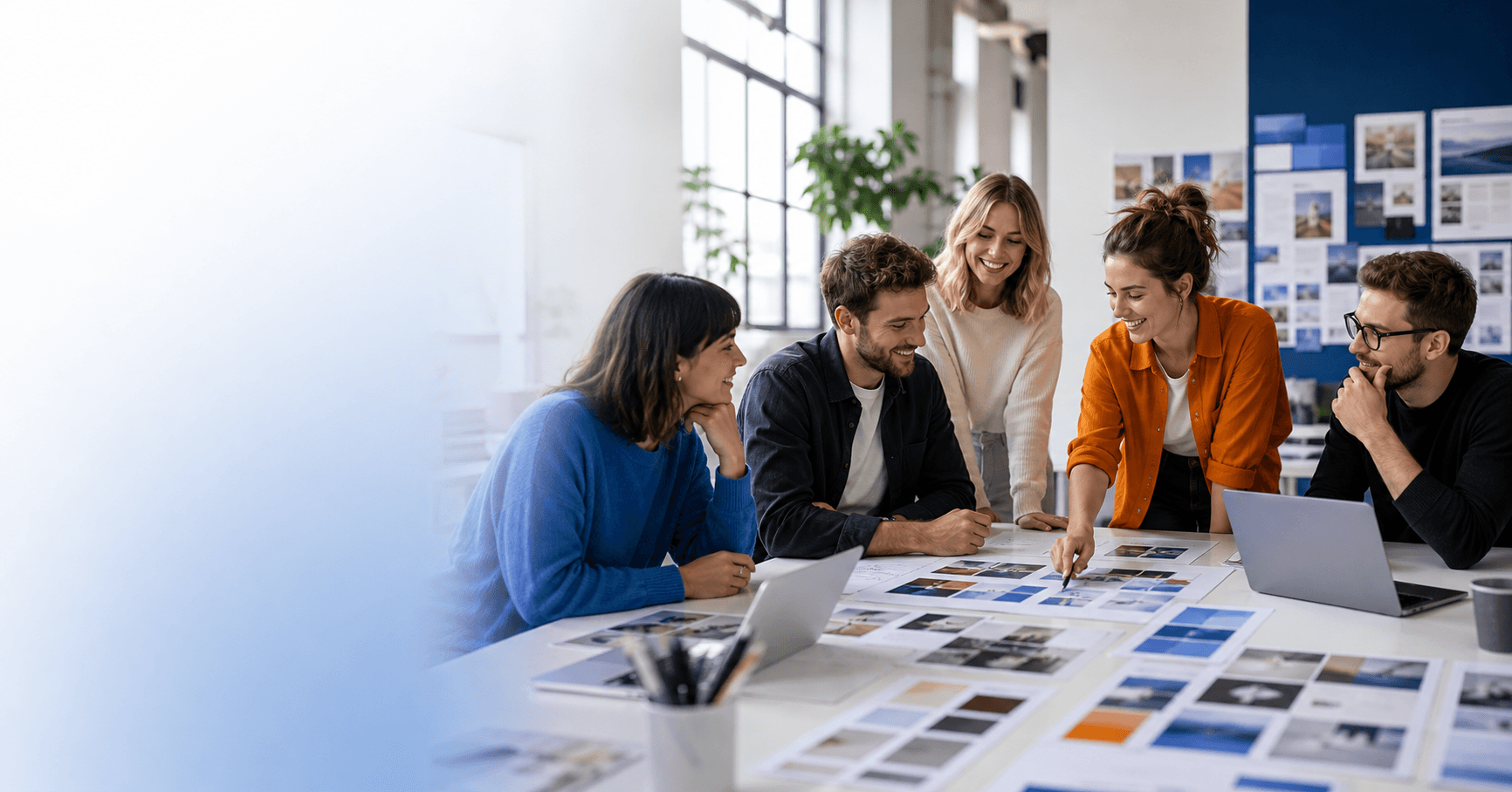 Creative agency team collaborating around a campaign plan